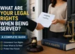 A process server delivering court papers while explaining the legal rights of a person being served with legal documents.